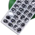 Ovale aufnähbare Kristall-Strasssteine mit doppelten Löchern, graue Glassteine für DIY. - 7x10 mm 72 Stk./Packung / 20 Grau