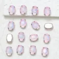 Detailed view of oval pink glass rhinestones with claw settings for DIY apparel crafts. - 50 Pink Opal Mocha