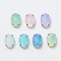 Closeup of oval glass rhinestones with silver claw settings, colorful DIY craft accessories. - 53 Mixed Color Opal Mocha