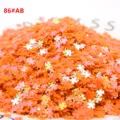 Paillettes laser a quadrifoglio arancioni fai da te accessori per abbigliamento e gioielli. - 10g/Confezione / Giallo arancio AB