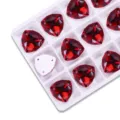 Red fat triangle flatback sew-on rhinestones detail view for DIY garment accessories crafting. - Bright Red