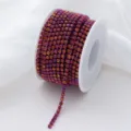 Detail shot of gradient AB color glass rhinestone cup chain, sparkling crystals on white spool. - SS6 2mm 1 Yard/Pack / Rose Glow