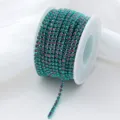 Close-up detail of gradient rhinestone claw chain, sparkling glass crystal trim for DIY crafts. - Dark Green Glow