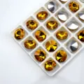 Wholesale round and oval point-back glass crystal rhinestones for jewelry and nail art crafts. - Golden