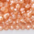 Dettagli in primo piano di strass moka in vetro piatto color pesca per nail art e fai da te. - Champagne mocha