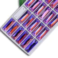 Closeup of rectangular dual-hole AB crystal rhinestones in purple orange iridescence, sewing diy. - Medium Purple AB