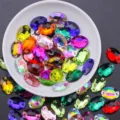 Bunte ovale Glaskristalle zum Aufnaehen mit flacher Rueckseite fuer DIY Handwerk - 7x10 mm 72 Stk./Packung / Mehrfarbig