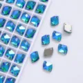 Close-up view of diamond shaped blue green AB crystal rhinestones with dual sew-on holes. - Peacock Green AB