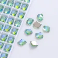 Detailed view of green AB color K9 glass sew-on rhinestones with double holes for DIY apparel. - Light Green AB