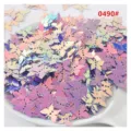 Close-up view of iridescent butterfly sequins for DIY nail art and craft design. - 13mm 10g/Pack / 09 Golden Shimmer Purple