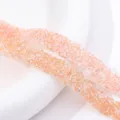 Detailed close-up of sparkling peach resin rhinestone banding trim for DIY craft accessories. - Water Pink AB (27)