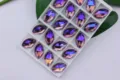 Paarse glinsterende navette glas strass steentjes om te naaien voor DIY jurken en kleding. - Violet AB / 9*18 mm 28 st./pak