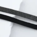 Detailed shot of sparkling rhinestone trim and black suede strap for DIY clothing and crafts. - 1m / 5 Rows of Rhinestones (11mm)
