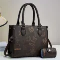 Detail view of a stylish dark brown leather tote bag with matching card pouch and letter print. - Coffee & Coffee