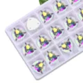 Detail view of fat triangle AB glass flatback sew-on rhinestones, perfect for DIY crafts. - 12mm 28 Pieces/Pack / 02 White AB