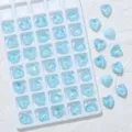 Detailansicht blaue herzförmige spitz zulaufende Strasssteine für Nagelkunst DIY. - 10 mm, 45 Stk./Packung / 05 Seeblau Mokka Opal