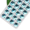 Light blue round dual-hole glass sew-on rhinestones for garment decoration and DIY crafts. - 14mm 28 Pieces/Pack / Lake Blue