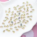 8x4.8mm Kristalglas Druppel Hotfix Platkeper Strass Glanzend Nagelkunst Groothandel En Gros - 100 Stuks/Pak / Goud