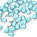 Strass di vetro ovali azzurri con montatura ad artiglio argentata per abiti fai da te. - 10 x 14 mm 50 pz/confezione / Blu Lago