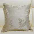 Detail view of a luxury jacquard cushion cover with exquisite gold wave embroidery. - Khaki 01 Piping