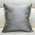 Close-up detail of grey decorative throw pillow featuring elegant abstract gold texture design. - Gray 02 With Piping