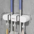 Supporto murale per scopa e mocio con ganci per organizzare lo spazio nel bagno. - 2 Clip 3 Ganci / Avorio