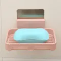 Wall-mounted plastic soap dish with draining design and adhesive backing for bathroom use. - Nordic Pink