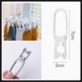 Plastic laundry clips for socks, durable windproof drying hangers, small household pegs. - White
