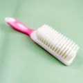 Pink soft bristle cleaning shoe brush with long curved anti-slip handle for footwear care. - Pink Shoe Brush