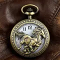 Detailed close-up of vintage bronze pocket watch featuring 3D running horse dial sculpture. - Hollow Steed