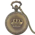 Vintage bronze quartz pocket watch with crown relief detail and matching chain accessory. - Bronze-Colored Crown