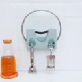 Wall-mounted kitchen pot lid holder and cutting board rack, space-saving storage organizer. - Blue