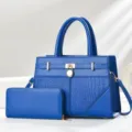 Blue embossed handbag and wallet set featuring elegant crocodile pattern and gold lock. - Blue Gold