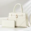 White women handbag and wallet set with crocodile embossed design and gold hardware. - White