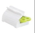 Manual plastic toothpaste squeezer rolling tube dispenser for facial cleanser and cream. - Green