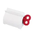 White plastic toothpaste squeezer dispenser, creative red wind-up key style manual roller. - Red