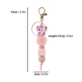 Detailed view of pink silicone bead keychain featuring butterfly and daisy flower pendants - Creative Beaded Keychain Pendant / Pink