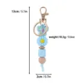 Blue silicone beaded keychain with butterfly and daisy charms, 13cm length. - Creative Beaded Keychain Pendant / Blue