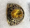 Vintage gold-toned US Army signet ring featuring a large faceted yellow oval gemstone - Gold With Yellow Rhinestone