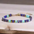 Handgemaakte etnische Tila-kraalarmband met blauwe, turquoise en goudkleurige kralen - Blauw Groen Goud Tila Stijl (Tila 26)