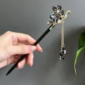 Elegant traditional sandalwood hair stick with black flower charm and beaded tassel - Black Translucent Five-Petal Flower Tassel Style (2844)
