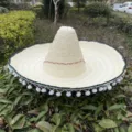 Mexican straw sombrero hat with colorful pom poms, perfect for festive party costume and dancing. - Diameter 53CM With Pompom Brim Mexican Hat / Beige