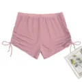 Close-up details of the pink mesh high-waisted swim shorts featuring adjustable side drawstrings. - Lotus root pink