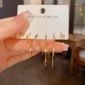 Set di orecchini a cerchio e lobo dorati con ciondoli a stella, croce e zirconi per donne. - Set di Orecchini Stella e Croce / Oro