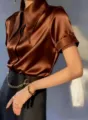 Elegant brown satin short sleeve shirt with chic collar and smooth glossy fabric finish detail. - S / Brown