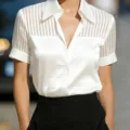 Detail view of the V-neck satin sheer striped short sleeve blouse showcasing exquisite texture. - S / White
