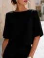 Detail shot of a minimalist black short sleeve top featuring elegant slit sleeve design. - S / Black
