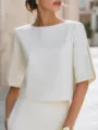 Detail view of a minimalist white short sleeve top featuring stylish slit sleeves. - S / White