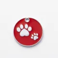 Placa de identificación redonda roja para mascotas en metal con huella blanca, aleación de zinc. - Diámetro 2,5 cm / Rojo