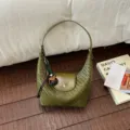 Green woven hobo shoulder bag detailed view, elegant dumpling bag design for daily commute. - With Charm / Green